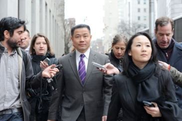 Liu with reporters around him